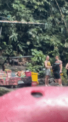 White water rafting group navigates tropical river in Indonesia