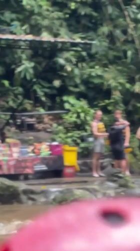 White water rafting group navigates tropical river in Indonesia
