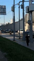 Ambulance travels through regular traffic in Khimki street scene