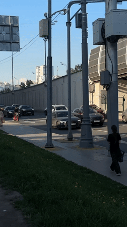 Ambulance travels through regular traffic in Khimki street scene