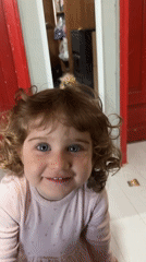 Young girl in pink observed playing indoors in Burgas