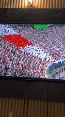 Nigerian viewer watches soccer match and superhero movie broadcasts