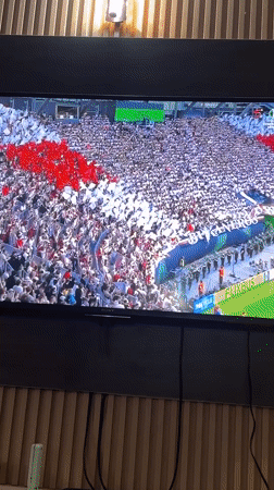 Nigerian viewer watches soccer match and superhero movie broadcasts