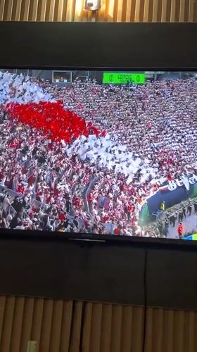 Nigerian viewer watches soccer match and superhero movie broadcasts