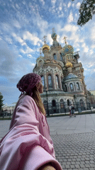 Tourist takes selfies at iconic Saint Petersburg church