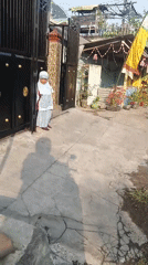 Scooter POV through a decorated residential street in Krian