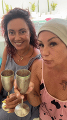 Women toast with silver goblets in Kuta Selatan