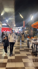 Evening street life and pizza-themed art documented in Buenos Aires