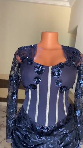 Navy dress displayed on mannequin in Akwanga, Nigeria
