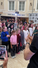 Children's fashion show held in marble-floored atrium venue