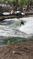Munich witnesses document river surfing, classical architecture scenes