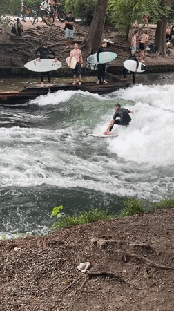 Munich witnesses document river surfing, classical architecture scenes