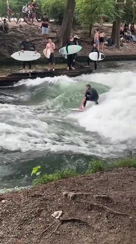 Munich witnesses document river surfing, classical architecture scenes