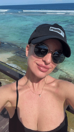 Beachgoers swim in turquoise waters at Ungasan tropical beach