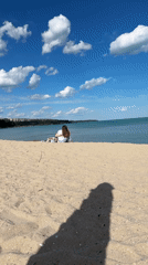 Woman enjoys sunny beach day in Varna, Bulgaria