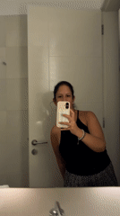 Woman Takes Bathroom Mirror Selfie in San Isidro