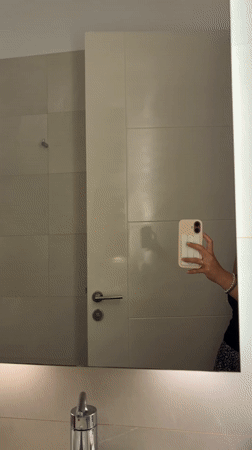 Woman Takes Bathroom Mirror Selfie in San Isidro