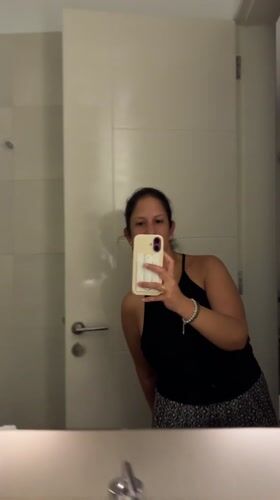 Woman Takes Bathroom Mirror Selfie in San Isidro