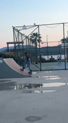 Rollerblader performs tricks at Fethiye skate park