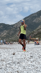 Runner, paragliders captured in morning scene at Fethiye beach