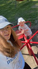 Mother, child enjoy playground time in Красный Маяк park