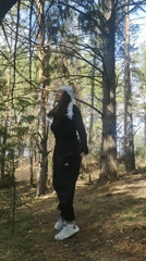 Person in tracksuit observed walking through Russian forest