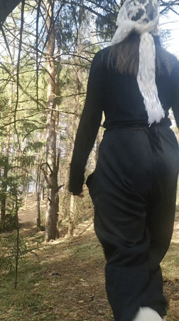 Person in tracksuit observed walking through Russian forest