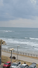 Surfers return to Tel Aviv waters after storm passes