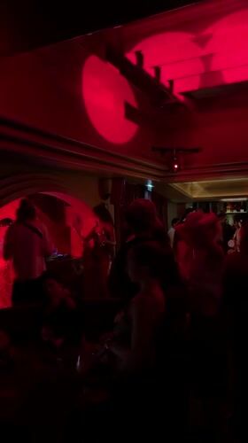 Red-lit Paris nightclub, late June evening