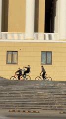 Teenage cycling group tours Votkinsk streets and waterfront areas