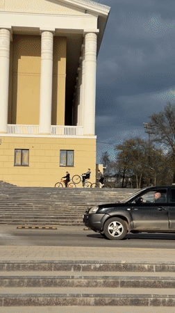 Teenage cycling group tours Votkinsk streets and waterfront areas