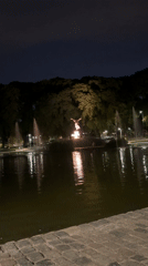 Nighttime fountains and illuminated statue captured at Buenos Aires park