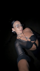 Woman poses for nighttime beach photoshoot in Indonesia
