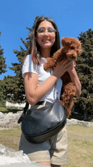 Woman poses with dog in Montenegro park