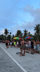 Skateboarders gather on road in General Luna, Philippines