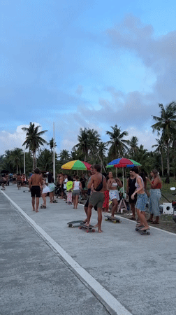 Skateboarders gather on road in General Luna, Philippines