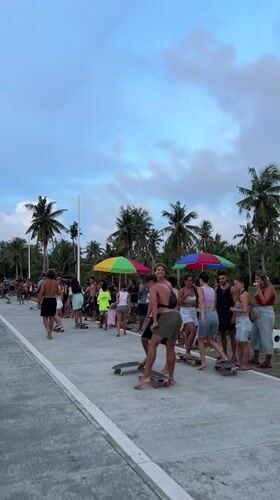 Skateboarders gather on road in General Luna, Philippines