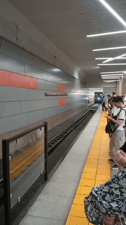 Metro platform and street traffic in Almaty
