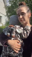 Backyard afternoon with kids, a baby, and open sky