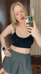 Woman takes selfies during early morning grooming routine in Saint Petersburg