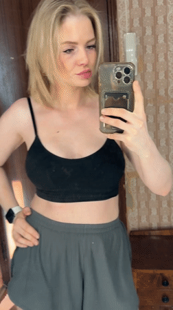 Woman takes selfies during early morning grooming routine in Saint Petersburg