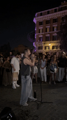 Live performance draws a crowd near Rome's Colosseum at night