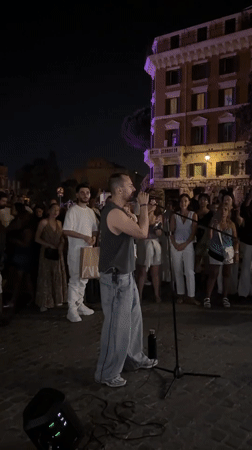Live performance draws a crowd near Rome's Colosseum at night
