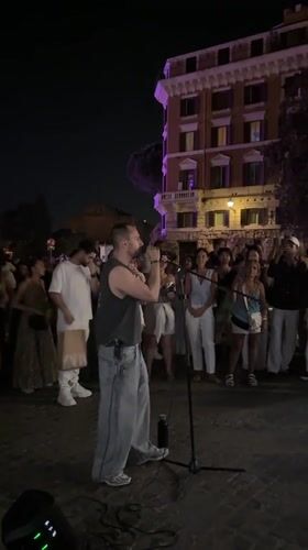 Live performance draws a crowd near Rome's Colosseum at night
