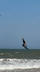 Kitesurfers hit the waves on a sunny Mũi Né morning