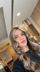 Woman records selfies at Berlin commercial location