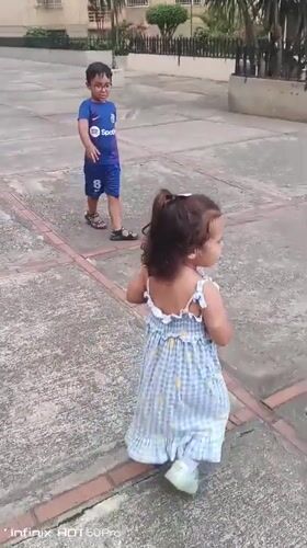 Kids playing in a Caracas outdoor courtyard, July 2026