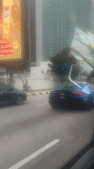 Blue Lamborghini spotted driving through downtown Kuala Lumpur streets