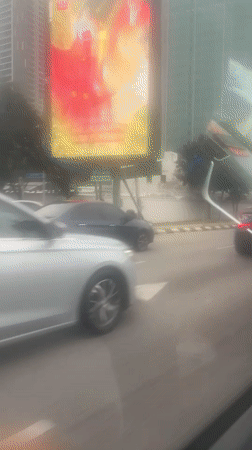 Blue Lamborghini spotted driving through downtown Kuala Lumpur streets