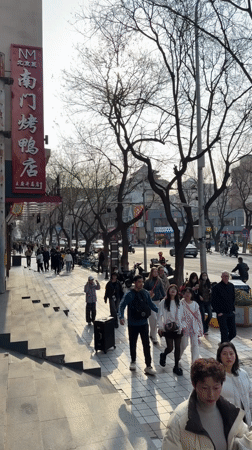 Late night street activity documented in Beijing's Dongcheng District